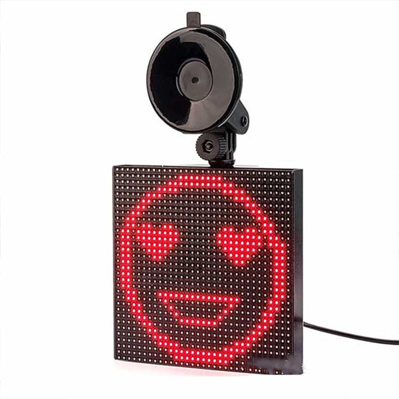 A vibrant square LED car display showcasing colorful emoticons and text, controlled via Bluetooth app.